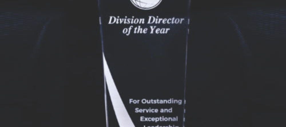 A Division Director of the Year Plaque with a black base and white color highlighting plate available for purchase on muskurado.com
